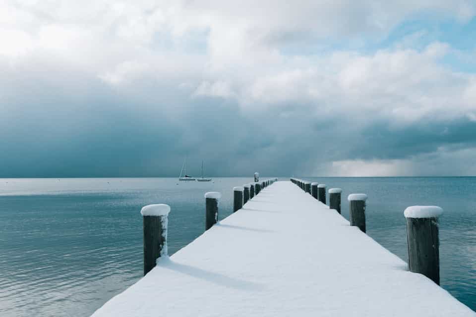 snowy lake dock